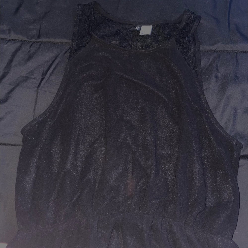 A black formal fitting dress.